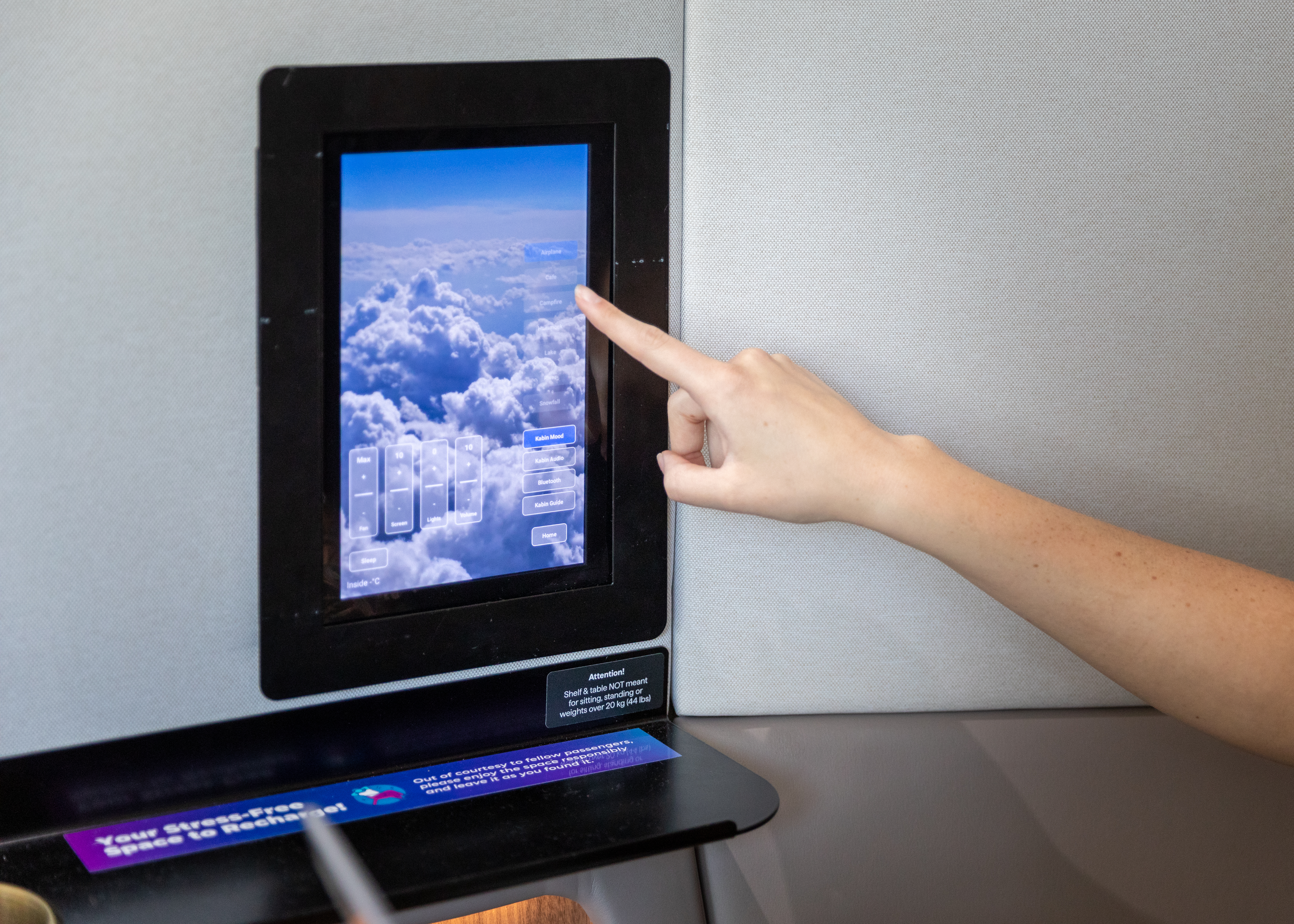 Inside Kabins Private Work Booth Passenger Using Tablet Feature Photo
