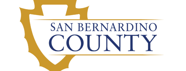 Gold shield-shaped logo for San Bernardino County with blue text