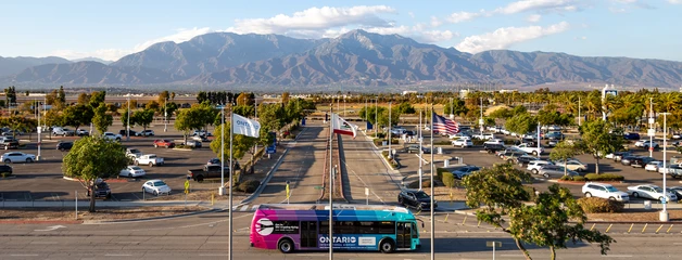 photo of parking lot with San Grabiel mountains in the background