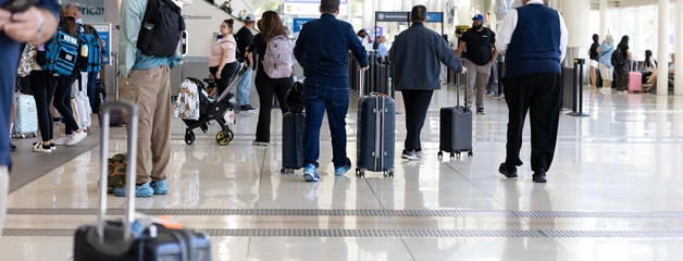 People at baggage claim at the airport