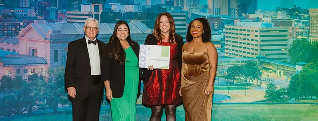 ONT accepting an award at a conference 