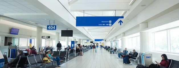 Passengers walking through terminal 