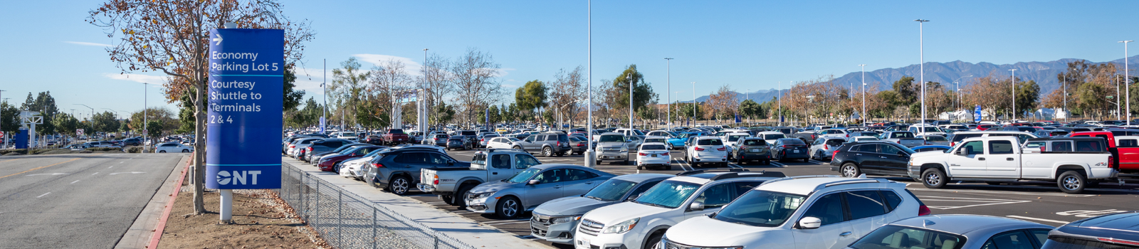 Parking lot 5 filled with cars. 