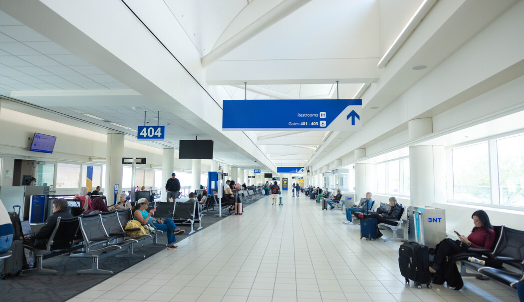 Passengers walking through terminal 
