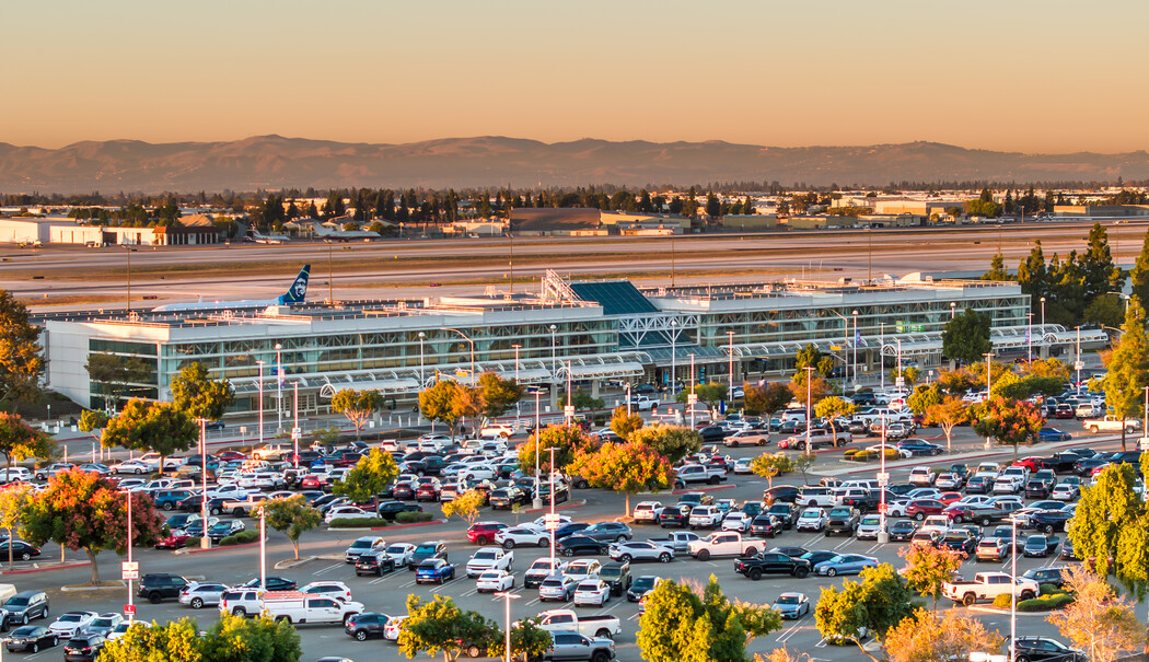 Overhead photo of the terminal, parking lot, and runway 